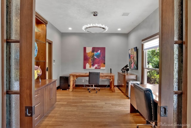 office area with light hardwood / wood-style floors