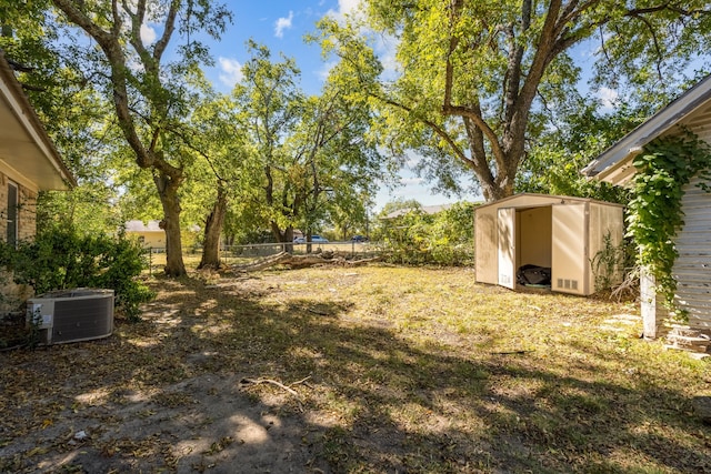 view of yard with a shed and central AC unit