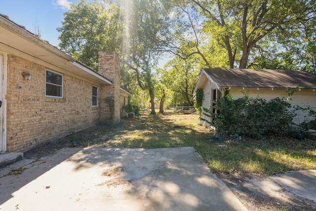 view of yard featuring a patio area and central AC unit