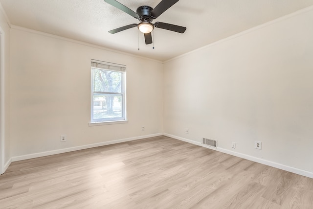 spare room featuring light hardwood / wood-style floors, crown molding, a textured ceiling, and ceiling fan