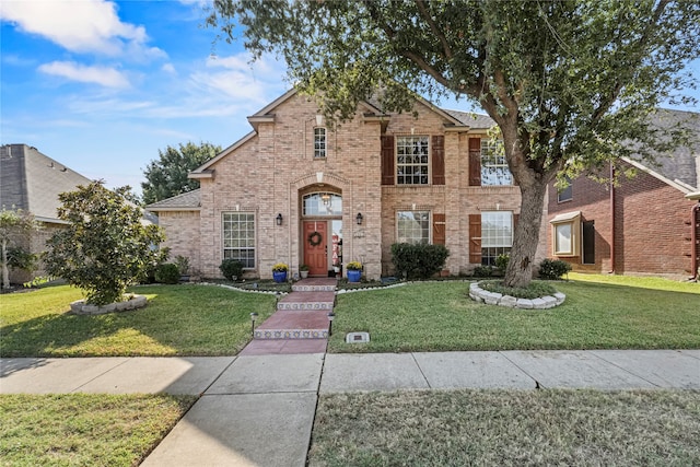 view of front of home with a front lawn