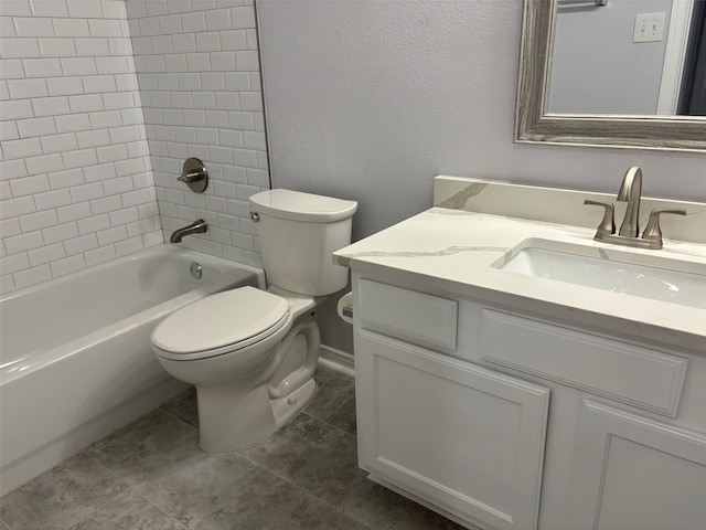 full bathroom featuring toilet, tiled shower / bath combo, vanity, and tile patterned floors