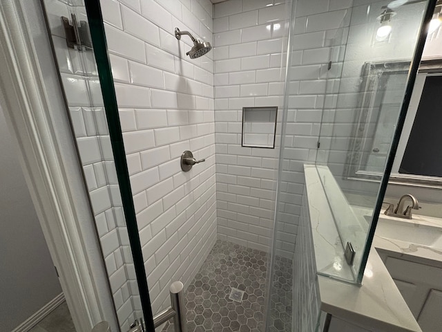 bathroom featuring vanity, walk in shower, and tile patterned floors