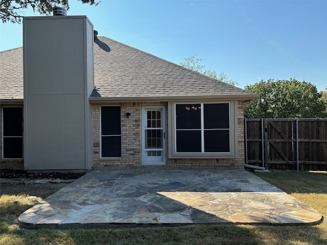 rear view of house with a patio