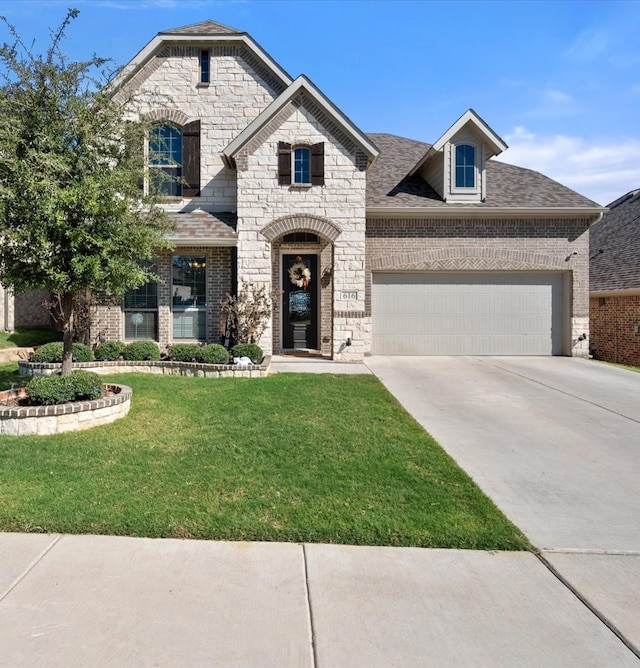 french country inspired facade with a garage and a front lawn