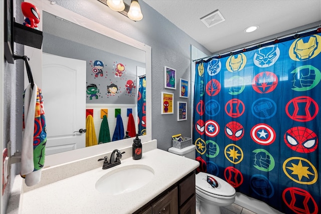 full bathroom featuring vanity, toilet, a textured ceiling, and shower / bath combo