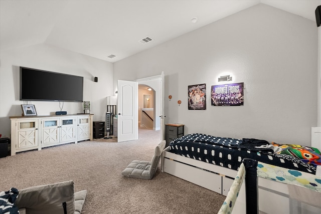 carpeted bedroom featuring lofted ceiling