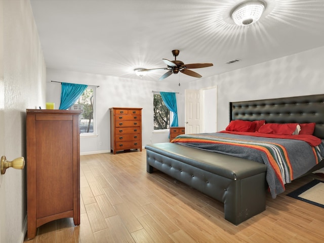 bedroom with wood-type flooring and ceiling fan