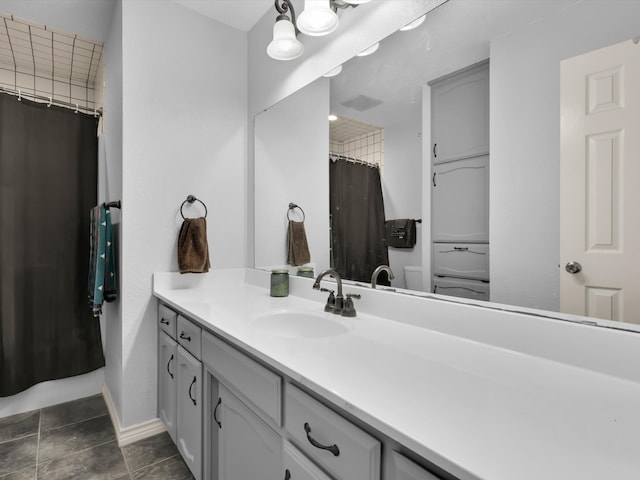 bathroom featuring vanity, toilet, tile patterned flooring, and a shower with shower curtain