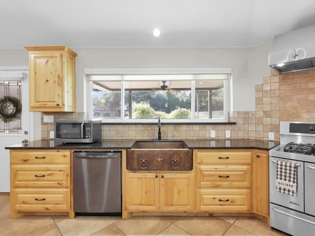 kitchen featuring tasteful backsplash, sink, stainless steel appliances, extractor fan, and light brown cabinets