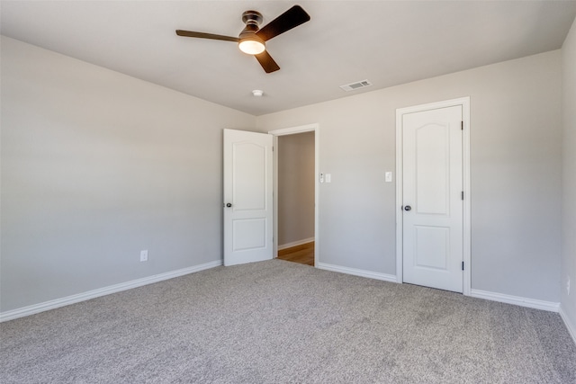 unfurnished bedroom featuring carpet flooring and ceiling fan