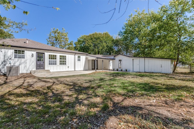 back of property featuring a yard, a patio, and central AC unit