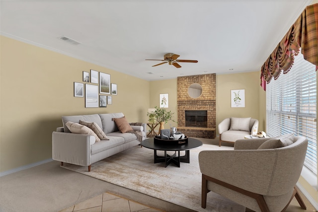 living room featuring ceiling fan and a brick fireplace