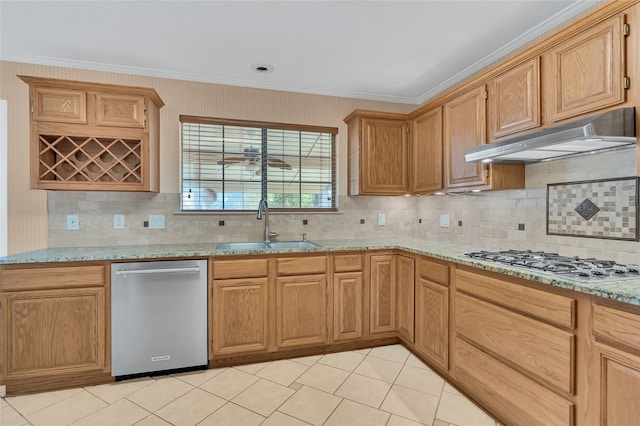 kitchen featuring light stone counters, backsplash, crown molding, and stainless steel appliances