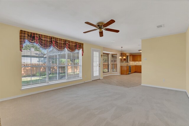 unfurnished living room featuring ceiling fan and light colored carpet