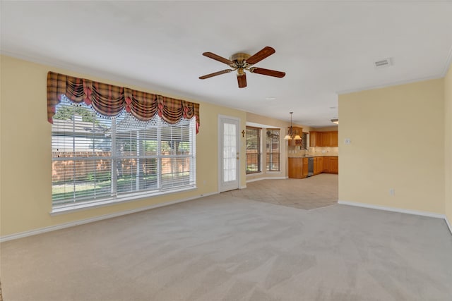 unfurnished living room with baseboards, light carpet, visible vents, and ceiling fan