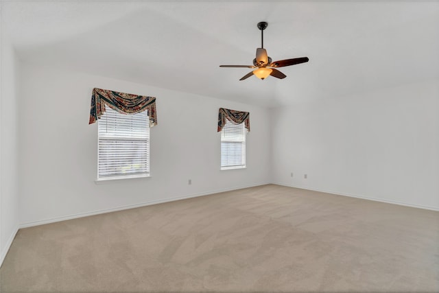 unfurnished room featuring ceiling fan and light carpet