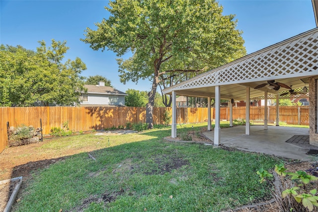 view of yard with a patio area, ceiling fan, a gazebo, and a fenced backyard