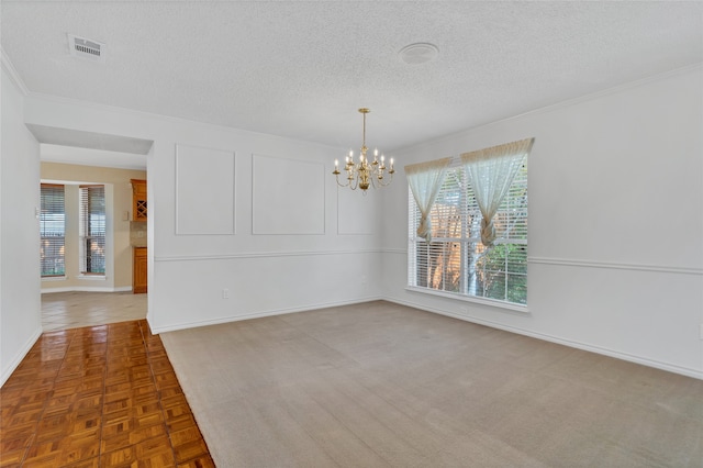 unfurnished room featuring parquet flooring, an inviting chandelier, and a textured ceiling