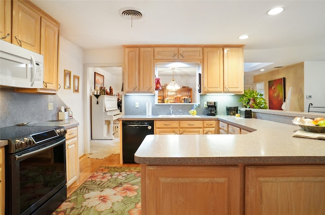 kitchen featuring light brown cabinets, black dishwasher, kitchen peninsula, electric range, and light hardwood / wood-style floors