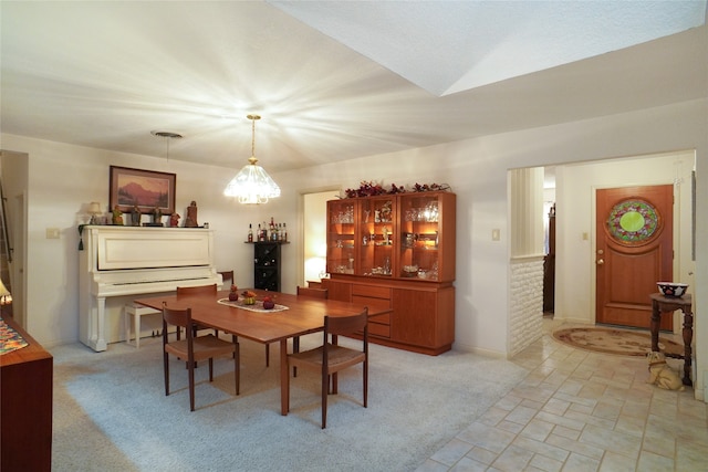 dining space with light carpet