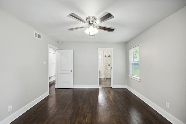 unfurnished bedroom with dark hardwood / wood-style flooring and ceiling fan