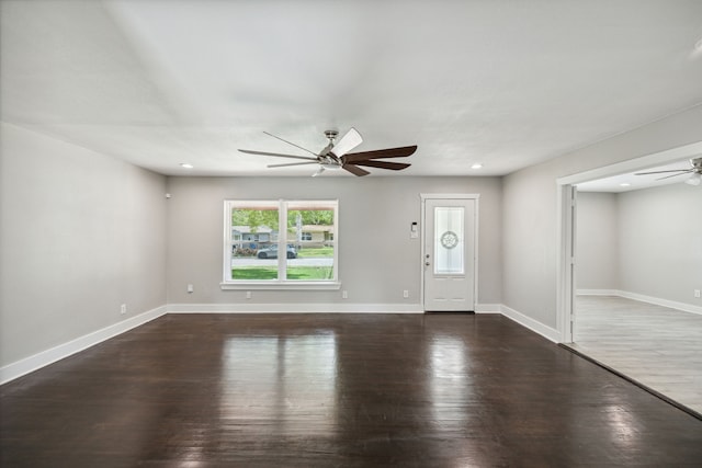 entrance foyer featuring ceiling fan and dark hardwood / wood-style flooring