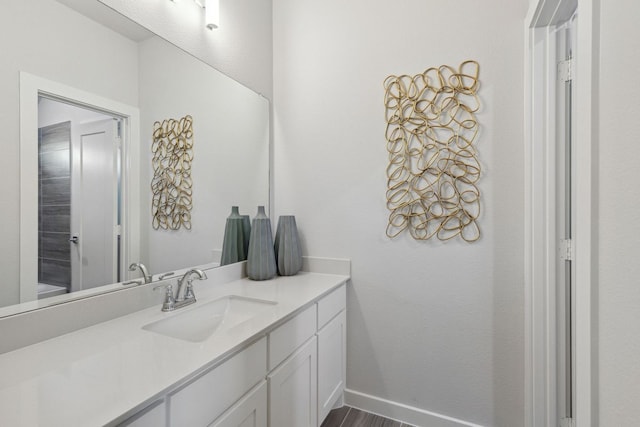 bathroom with vanity and hardwood / wood-style floors