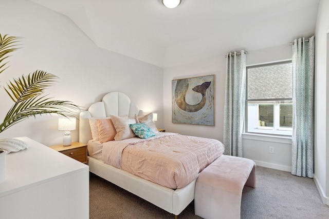 carpeted bedroom with vaulted ceiling