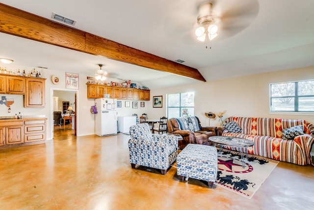 565 Turkey Ridge Rd, Stephenville, TX 76401 - living room with ceiling fan, concrete floors, beamed ceiling, and baseboards