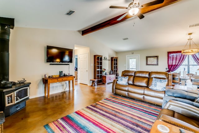 565 Turkey Ridge Rd, Stephenville, TX 76401 - living area featuring a wood stove, ceiling fan, baseboards, and finished concrete floors
