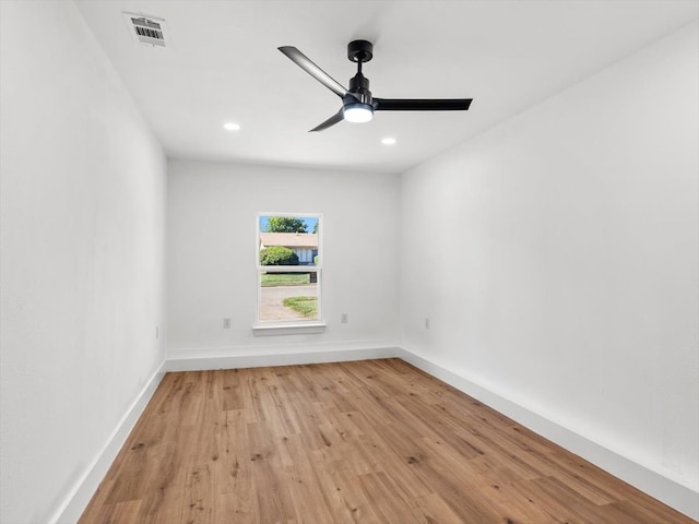 spare room with ceiling fan and light hardwood / wood-style flooring