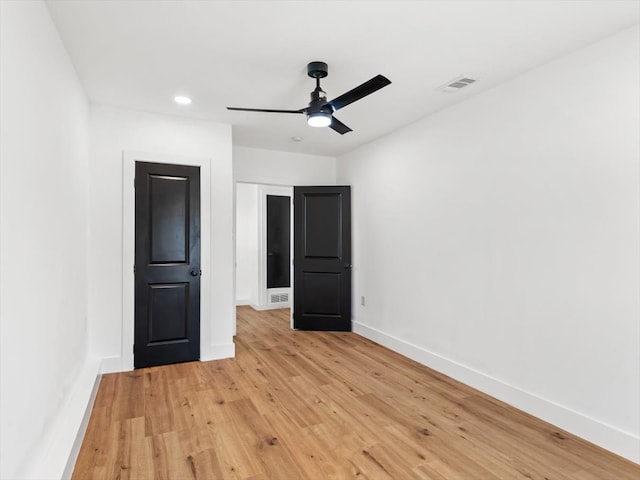 unfurnished bedroom featuring ceiling fan and light hardwood / wood-style floors