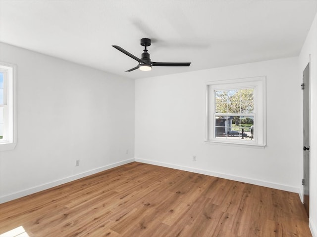 unfurnished room featuring ceiling fan and light wood-type flooring