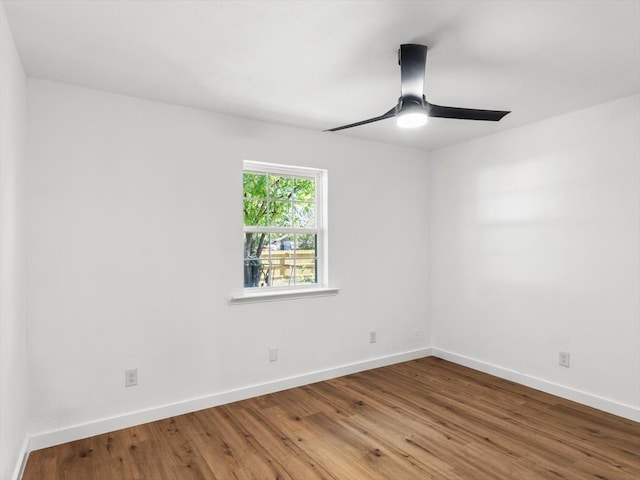 unfurnished room featuring ceiling fan and hardwood / wood-style flooring