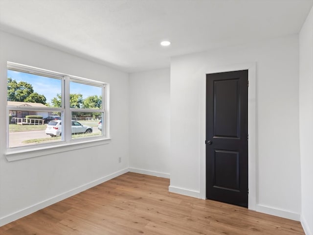 unfurnished room featuring light wood-type flooring