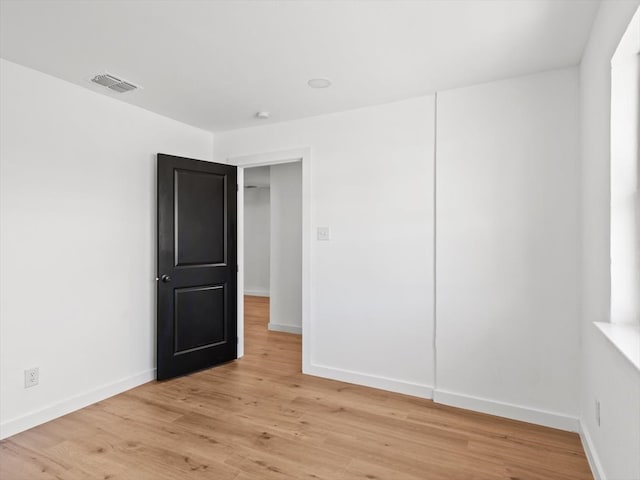 spare room with light hardwood / wood-style floors