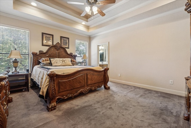 carpeted bedroom featuring ensuite bath, ornamental molding, multiple windows, and ceiling fan