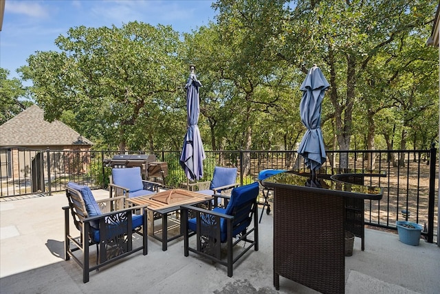 view of patio / terrace with an outdoor fire pit