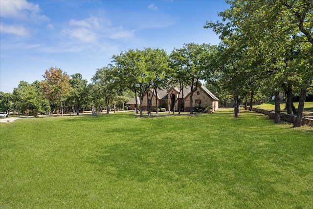 view of home's community featuring a lawn