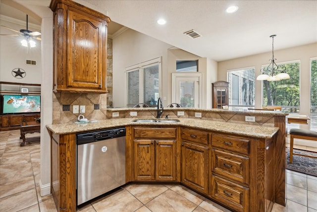 kitchen with kitchen peninsula, stainless steel dishwasher, sink, and crown molding