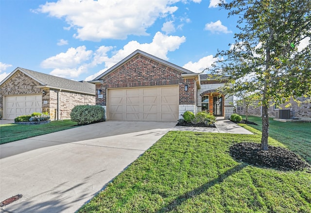 view of front of house featuring a front lawn, central AC unit, and a garage