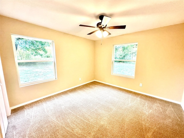 spare room featuring carpet floors and ceiling fan