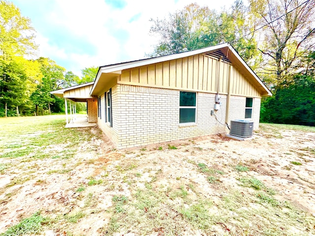 view of property exterior with central AC unit