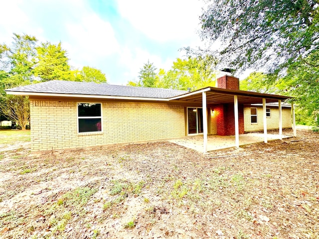 back of property featuring a patio