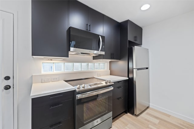 kitchen featuring light hardwood / wood-style floors and stainless steel appliances