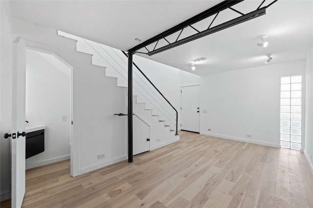 basement featuring light hardwood / wood-style flooring