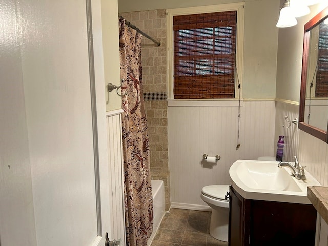 full bathroom with tile patterned flooring, vanity, toilet, and shower / bathtub combination with curtain