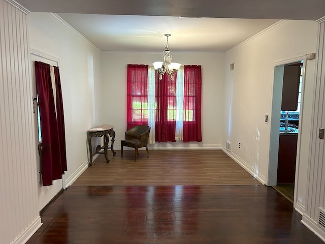 interior space with ornamental molding, dark hardwood / wood-style flooring, and a notable chandelier