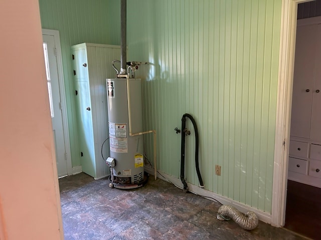 utility room featuring gas water heater